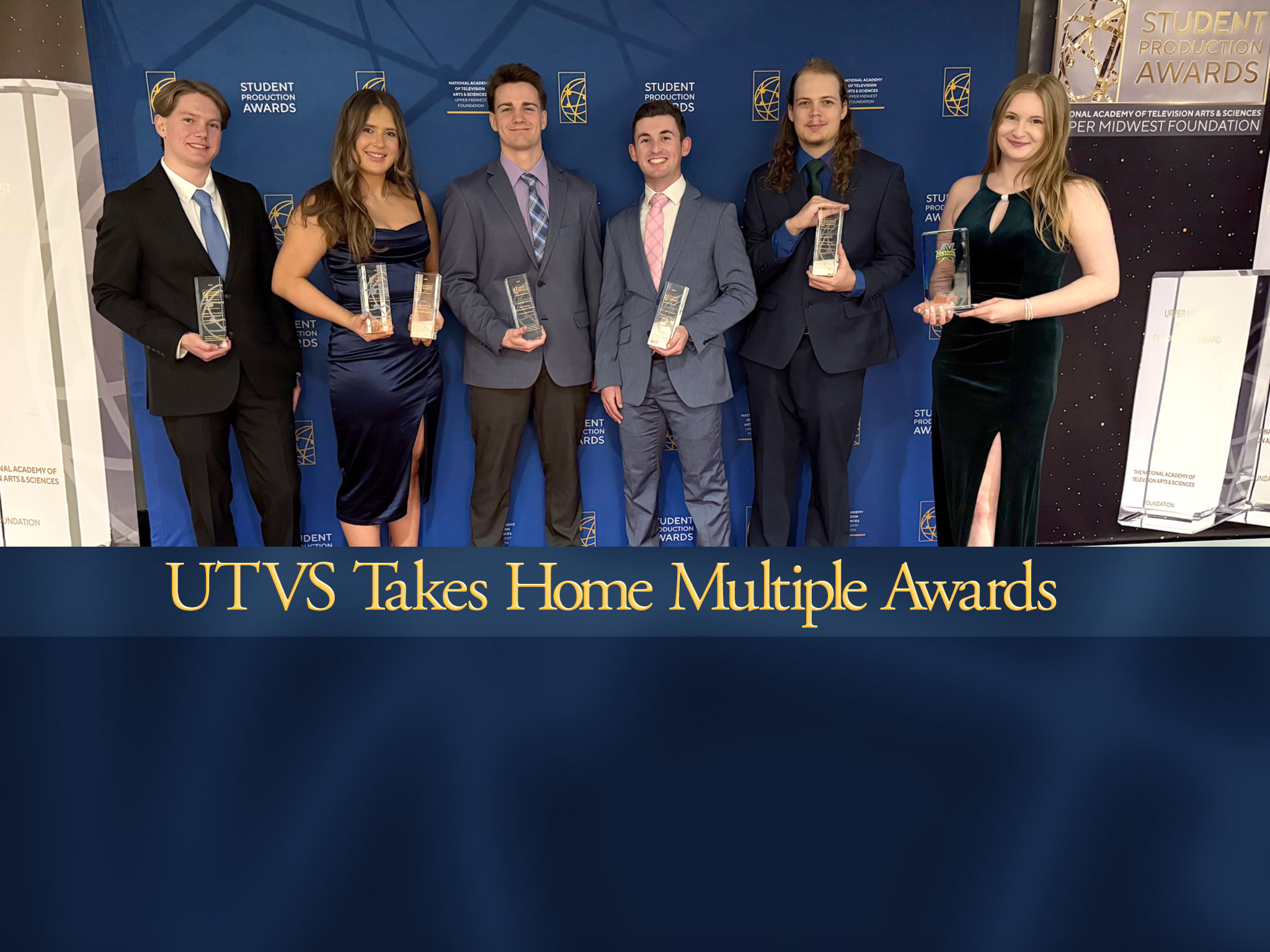 A photo of UTVS members holding awards.