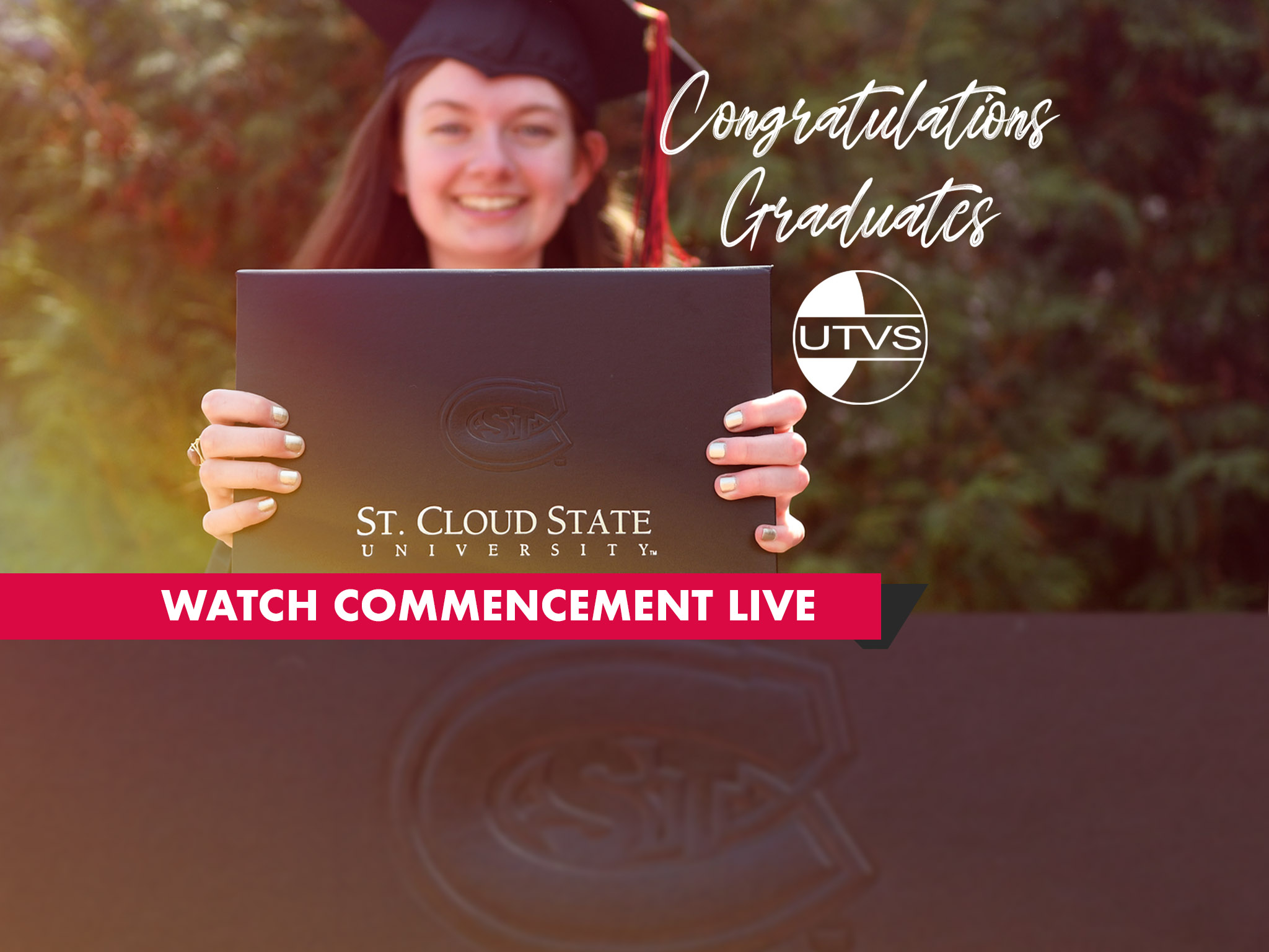 A photo of an SCSU Student at a Commencement ceremony holding a diploma cover with an SCSU logo imprinted with decorative text saying Congratulations Graduates and the words Watch Commencement Live behind a red background.